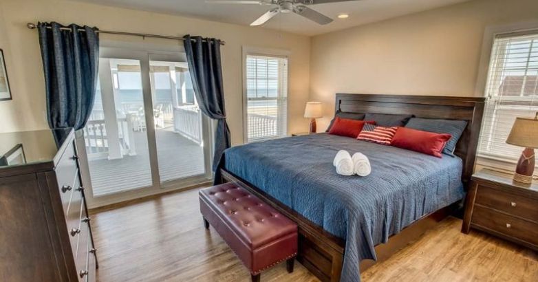 Custom home bedroom with simplicity design and overlooking view of the sea by RBC Homes