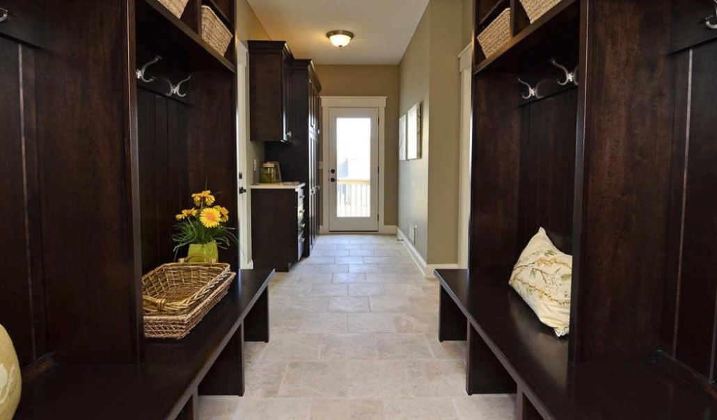 Elegant house with custom mudroom features built-in benches, cubbies, ang minimalist hooks