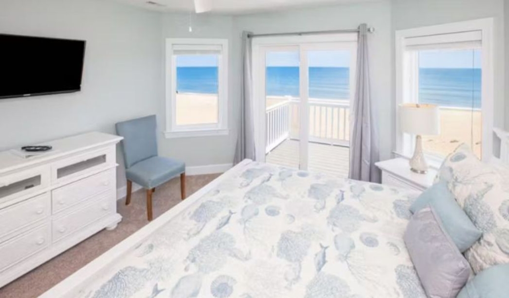 The Over the Moon budget-friendly bedroom with aesthetic design and overlooking view of the sea