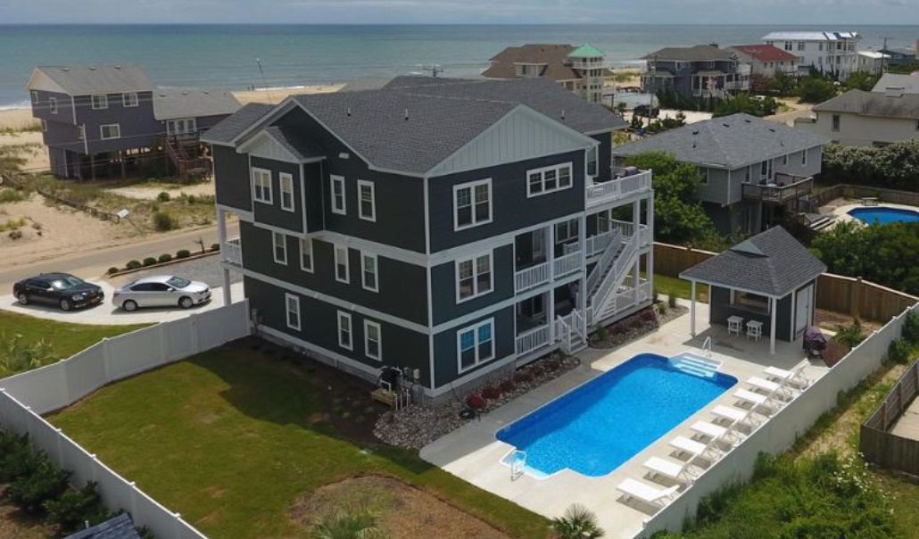 The Attitude Adjustment semi-oceanfront house built by RBC Homes featuring outdoor pool and luxury custom home