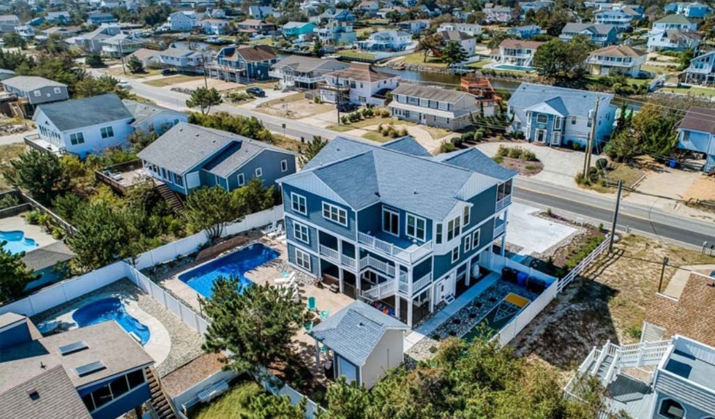 Aerial view of custom houses in Virginia Beach featuring luxury houses with easy access on the road