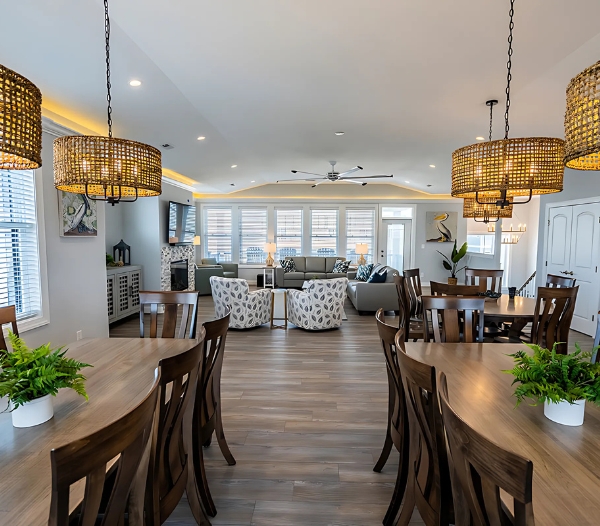 Spacious living and dining rooms flow into the kitchen, showcasing an open layout in a Great Neck Virginia Beach residence.