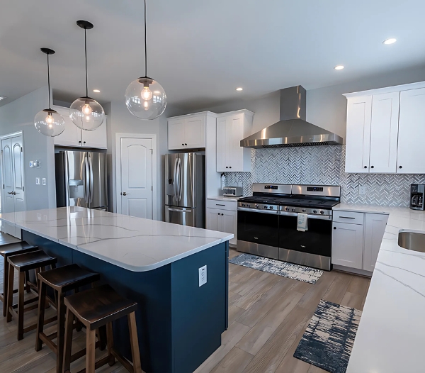 Elegant kitchen design with white cabinetry and blue countertops, highlighting quality craftsmanship from Little Neck Virginia Beach Home Builders.