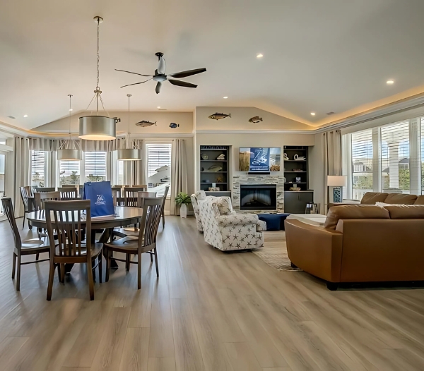 A spacious living and dining room blend with the outdoor space, showcasing custom design in Virginia Beach.