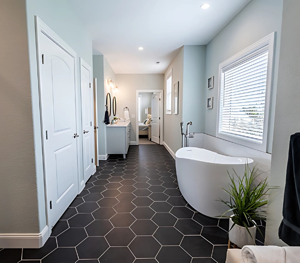 A stylish bathroom featuring a tub and shower, showcasing personalized design by Alanton Virginia Beach Home Builders.