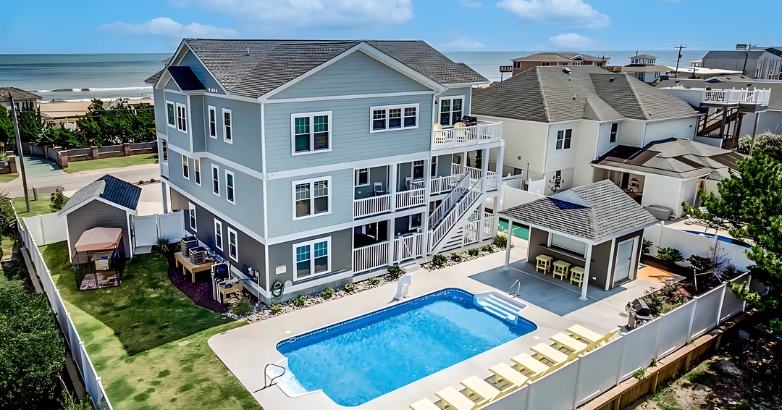 A Ruff Life family-friendly house with a pool overlooking the beach at Virginia Beach, perfect for relaxation and fun.