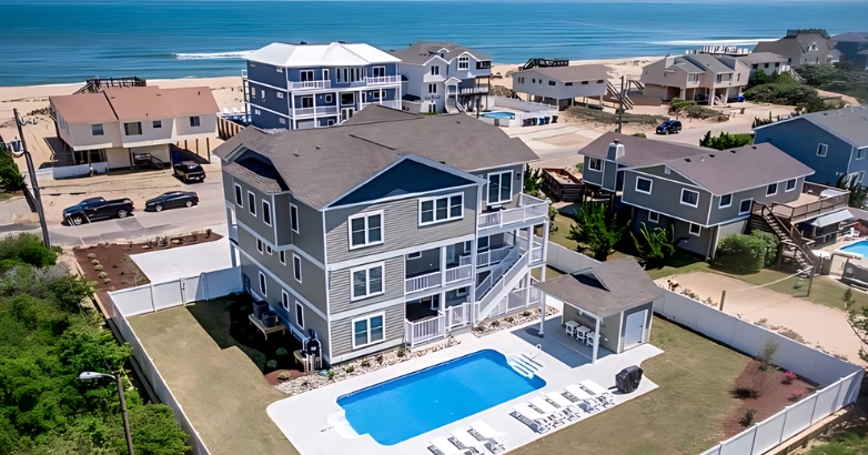 A beautiful home with a pool and beach backdrop, representing the diverse communities of Virginia Beach.