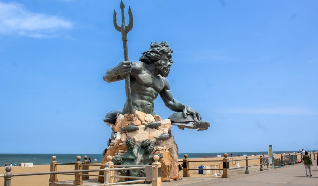 A statue of poseidon overlooks the beach, embodying the coastal charm of Virginia Beach.