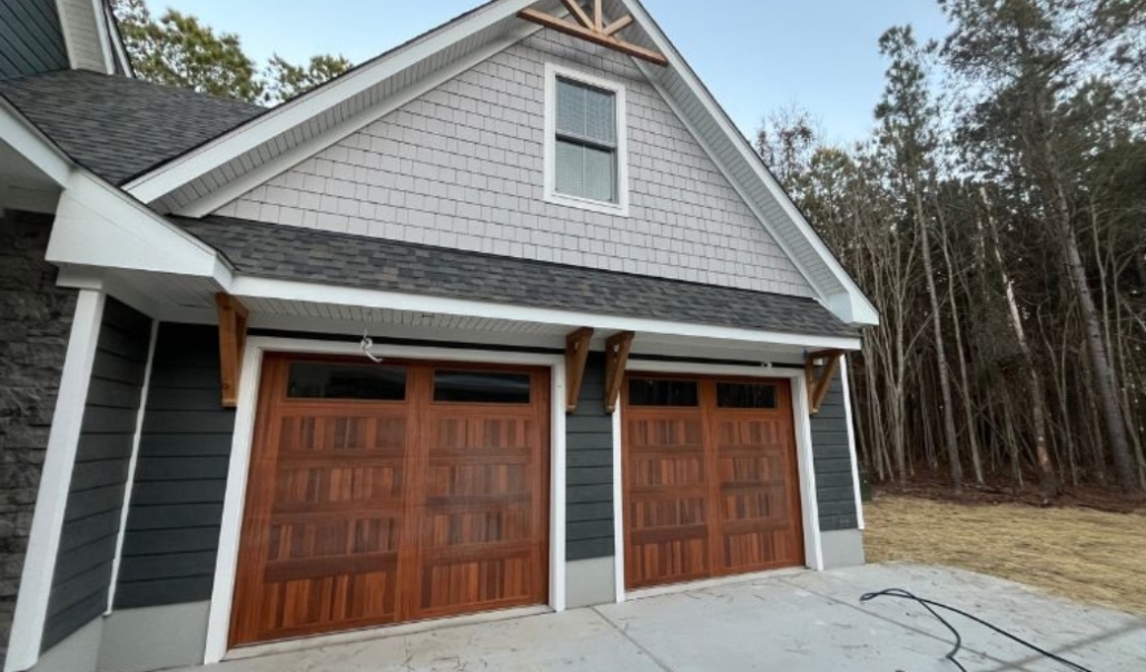 Garage doors adorned with wood trim and a roof, illustrating options for ADUs in Virginia Beach contractor selection.