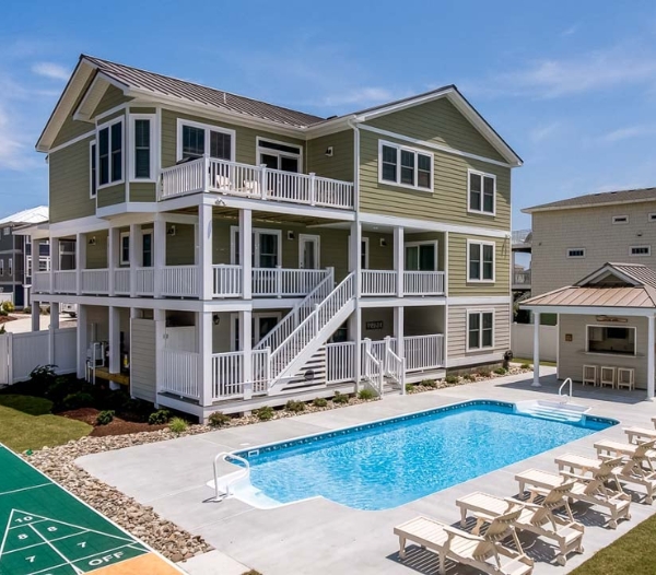 A residential property with a pool and deck, showcasing sustainable siding solutions in Virginia Beach.