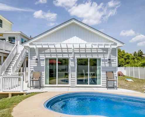 A house with a pool and decking, representing detached accessory dwelling units in Virginia Beach.