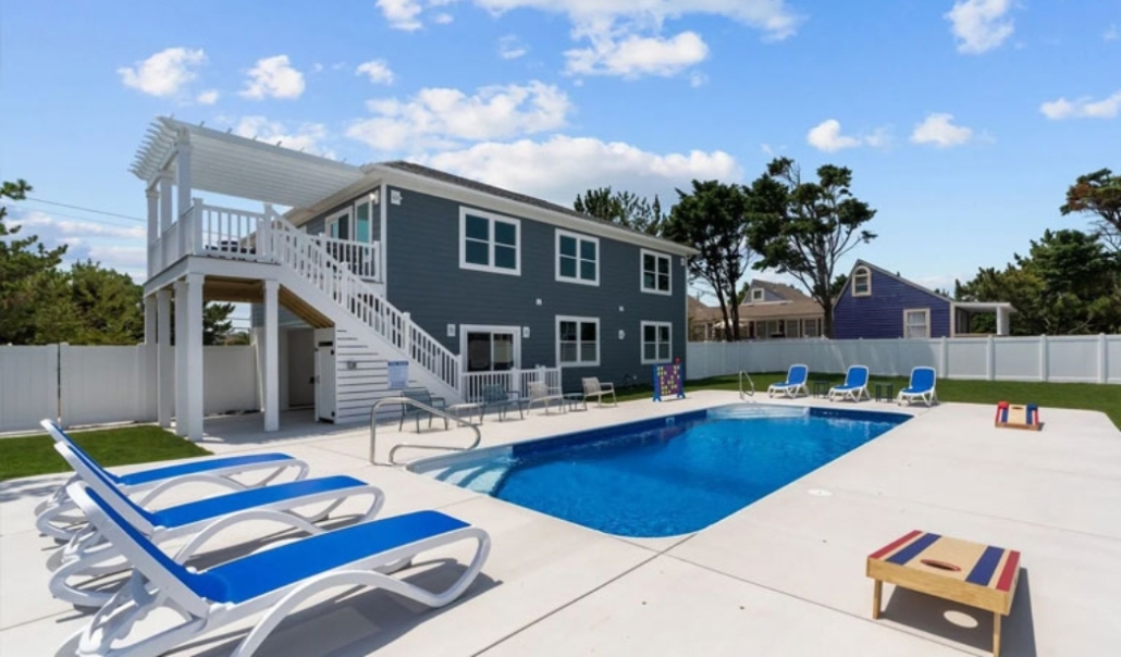 A residential house with a pool and deck chairs, relevant to the ADU approval and permitting process in Virginia Beach.