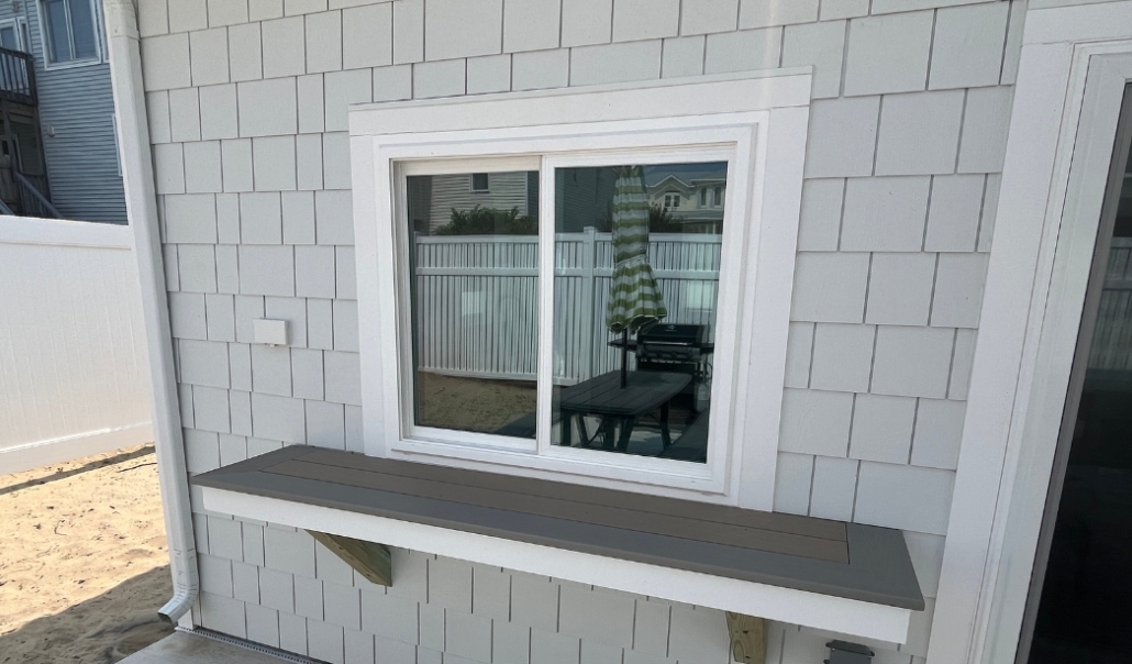 A house features a window, representing a home remodel project aimed at increasing value with window replacement.