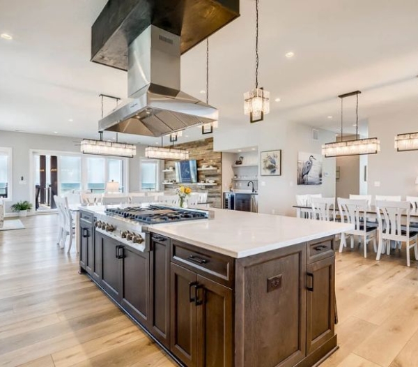 Modern kitchen with a central island and generous dining space, reflecting the quality of Ocean Lakes Virginia Beach Homebuilders.
