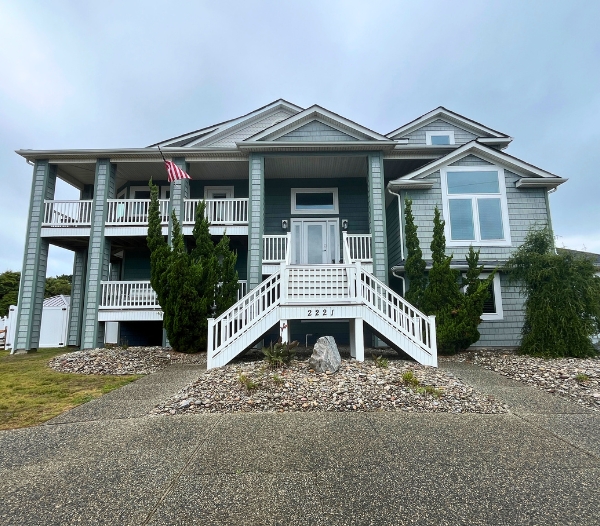 A prominent house featuring stairs to the entrance, highlighting a remodeling project in Virginia Beach.