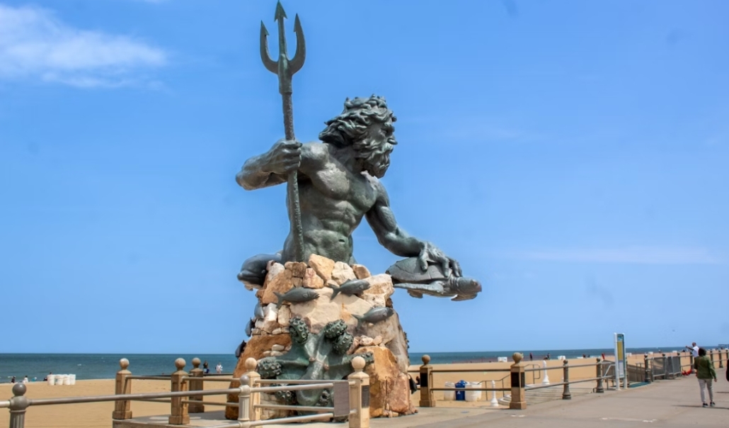 The Neptune statue, depicting a man with a trident, is positioned on the beach at Virginia Beach in January.