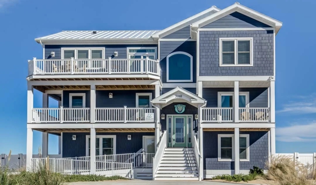 Two-story residence with blue siding and white trim, representing effective siding solutions for Virginia Beach homes.