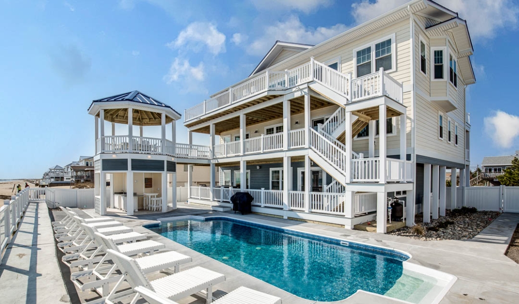 A stylish beach house with a pool and deck in Virginia Beach, built by American Dream Contractors for seaside relaxation.