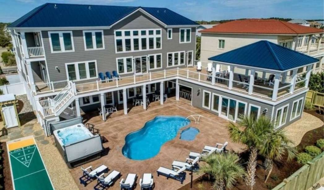 Luxury beachside custom home featuring durable exterior materials and modern coastal design.