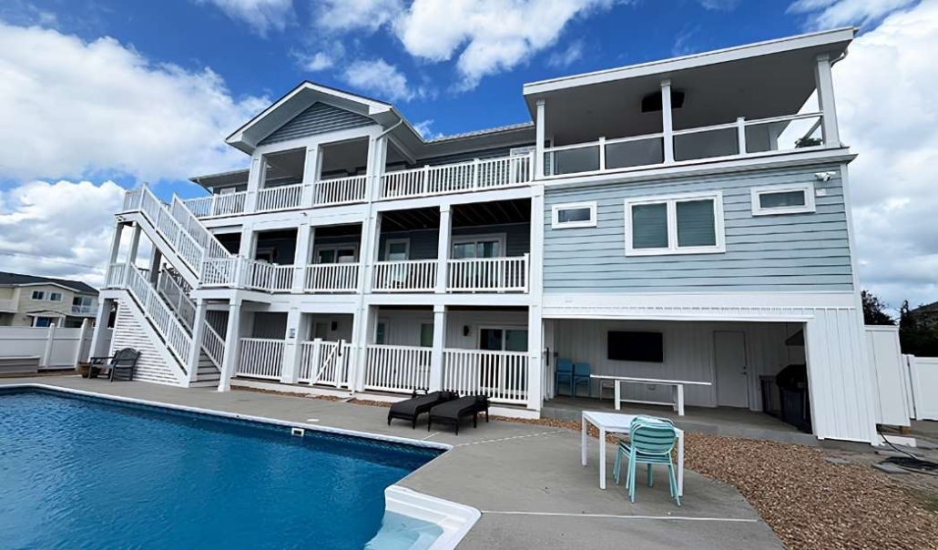 Finished custom beach home showcasing exterior details, outdoor living, and project completion.