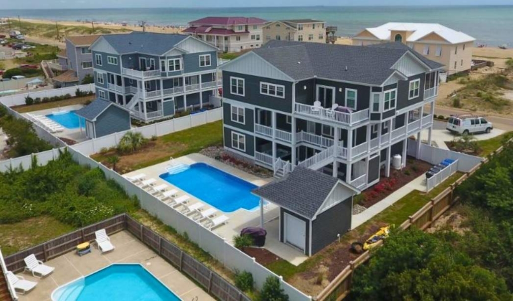 Oceanfront custom home with elevated design, pool, and panoramic coastal views