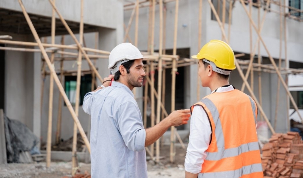 The owner inspecting their custom home development and coordinating on-site building work.