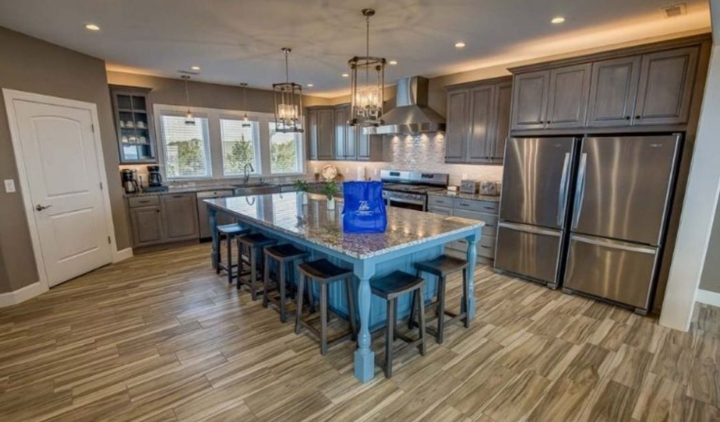 How to Design a Custom Home: High-end custom kitchen balancing upgraded features with practical everyday functionality.