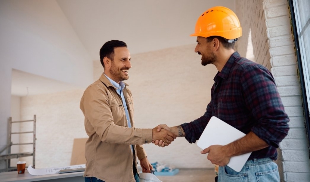 Homeowner consulting with a Virginia Beach builder before purchasing land for a custom home.