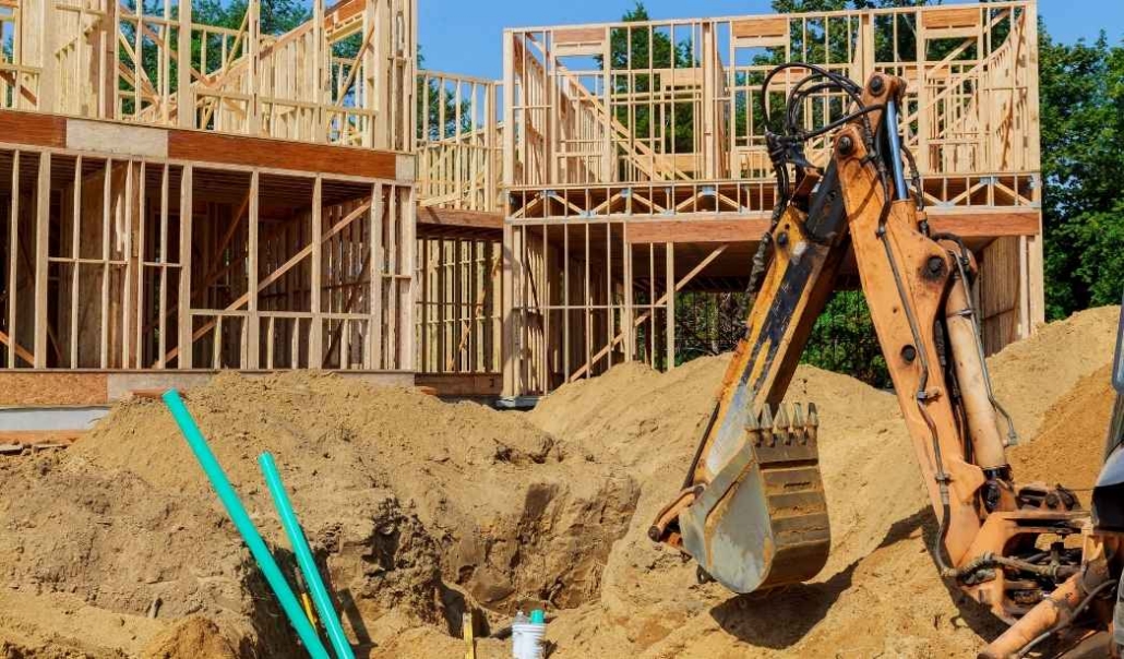 Custom home foundation work in Virginia Beach with framing and site development underway.
