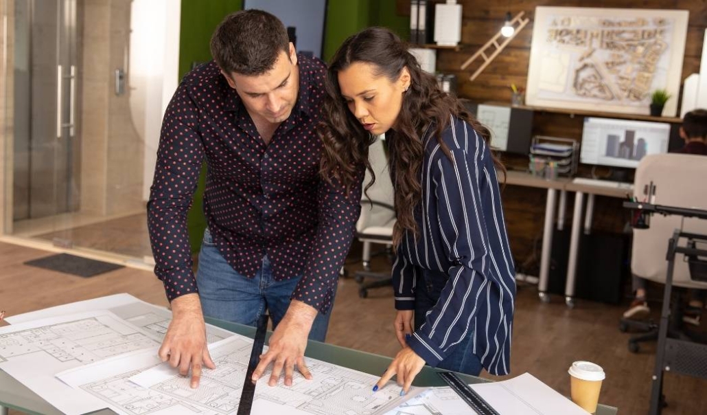 Reviewing zoning maps and home plans before building on land in Virginia Beach.