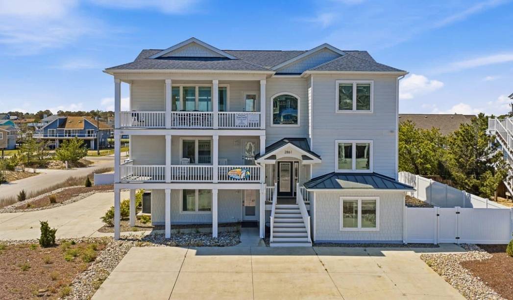 Elevated custom home with spacious porches in Virginia Beach by RBC Homes