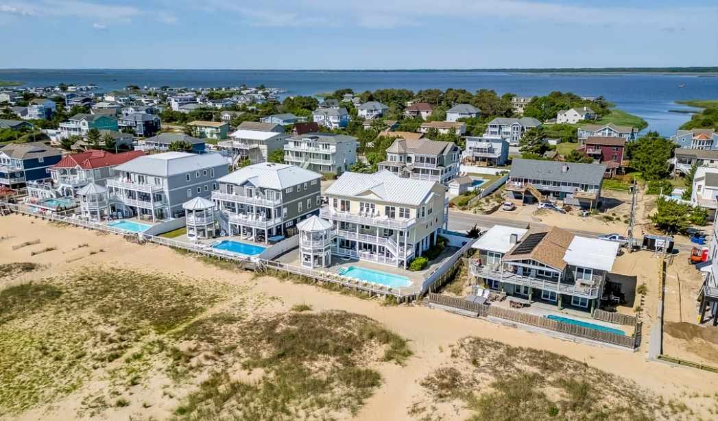 Aerial view of Virginia Beach oceanfront homes highlighting population growth and investment potential.