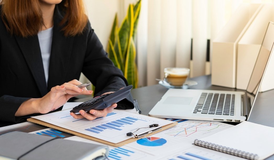 Property manager reviews rent collection and financial reports for a Virginia Beach investment property.