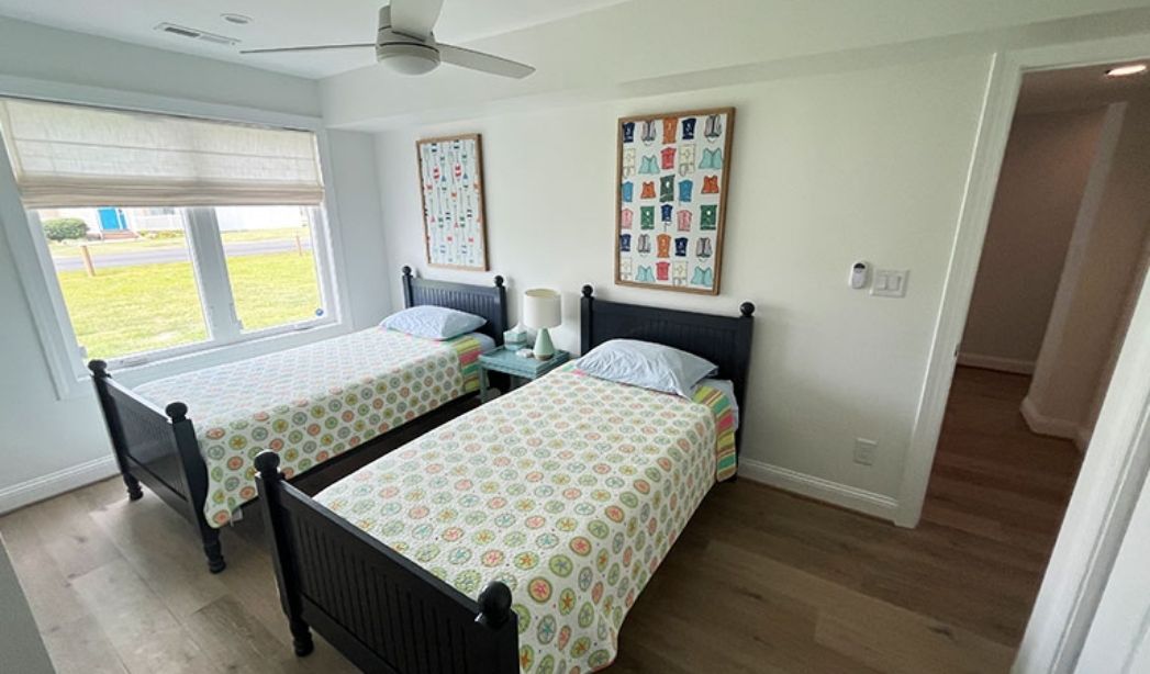 Bedroom addition with twin beds and natural light in a Virginia Beach home