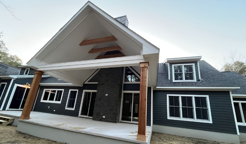 Front porch addition with exposed wood beams on a custom Virginia Beach home