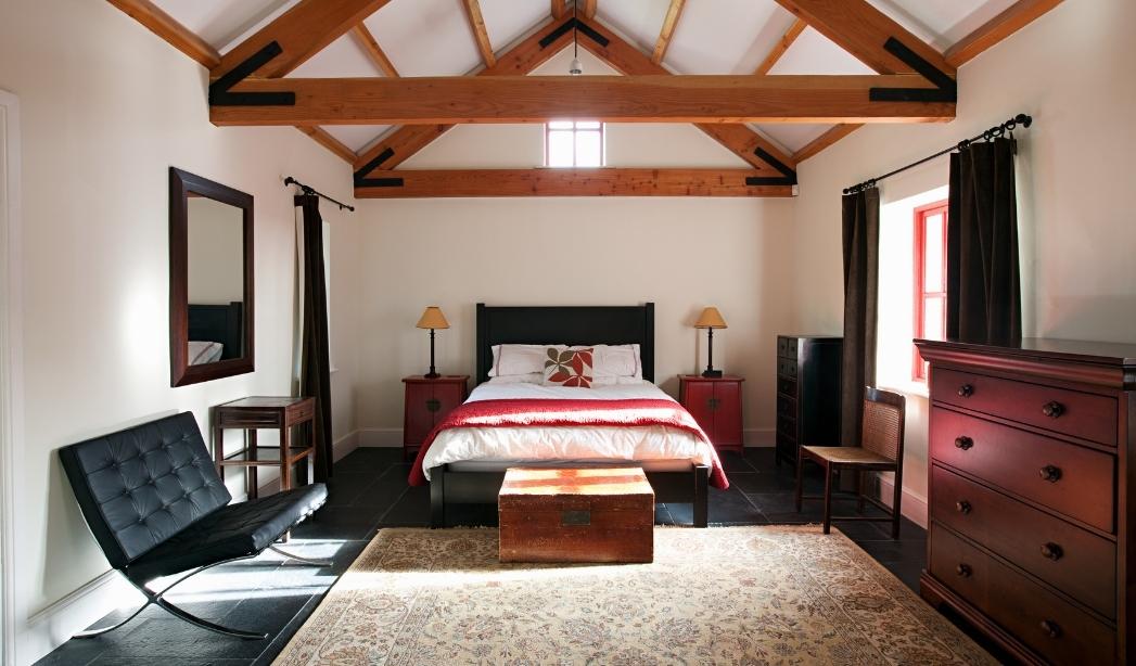 Primary suite addition with vaulted ceiling and exposed wood beams in a Virginia Beach home