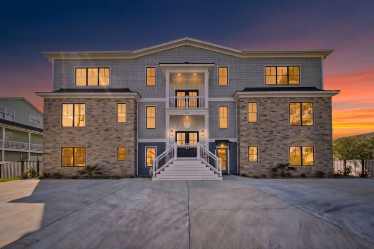 Custom Virginia Beach home at sunset with a spacious multi-level design.