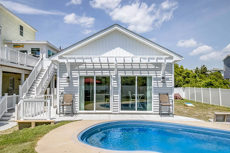 A house with a pool and decking, representing detached accessory dwelling units in Virginia Beach.