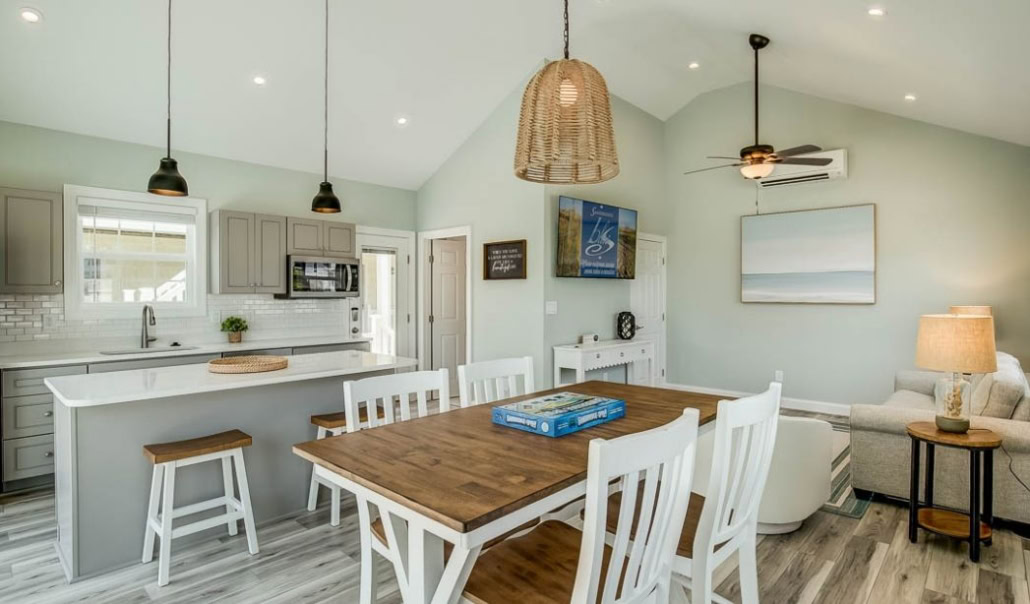 ADU interior with an open-plan kitchen, dining area, and living space for guests or family.