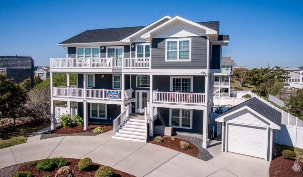Coastal home with multiple private balconies, separate garage, and elevated living spaces for added privacy.